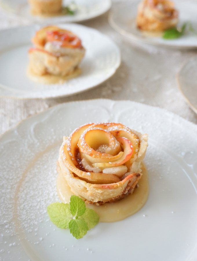 Apple Blossoms baked in a buttery pastry and drenched in rum caramel sauce