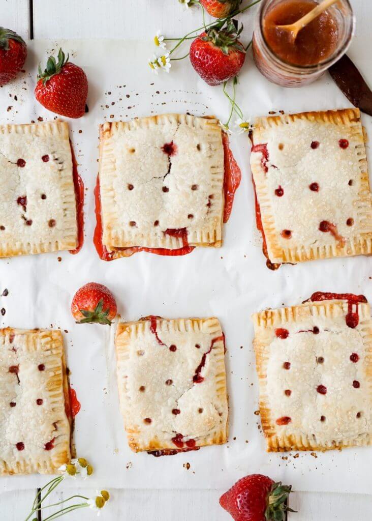 Adult Homemade Pop Tarts with rhubarb ginger compote and fresh strawberries.