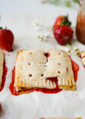 Adult Homemade Pop Tarts with rhubarb ginger compote and fresh strawberries.