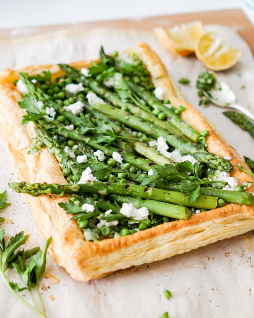Step Three: Now lay the charred asparagus and peas on top, adding fresh parsley and drizzle with a little more lemon to finish it off. Doesn’t that sound like the perfect spring time tart?